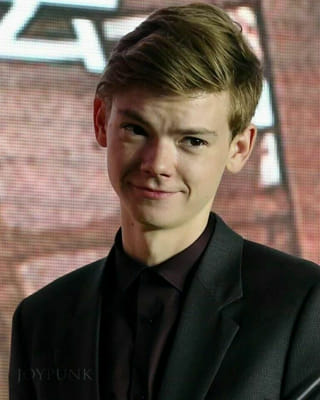 Thomas brodie-sangster with a blue cast and crutches on Craiyon