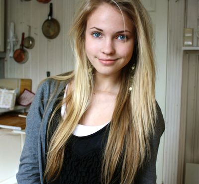 Beautiful teenage girl, 16 year old, with blonde hair and blue